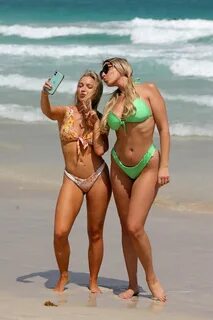VICTORIA LARSON and ALISON KAY BOWLES in Bikinis at a Beach in Miami 03/22/...