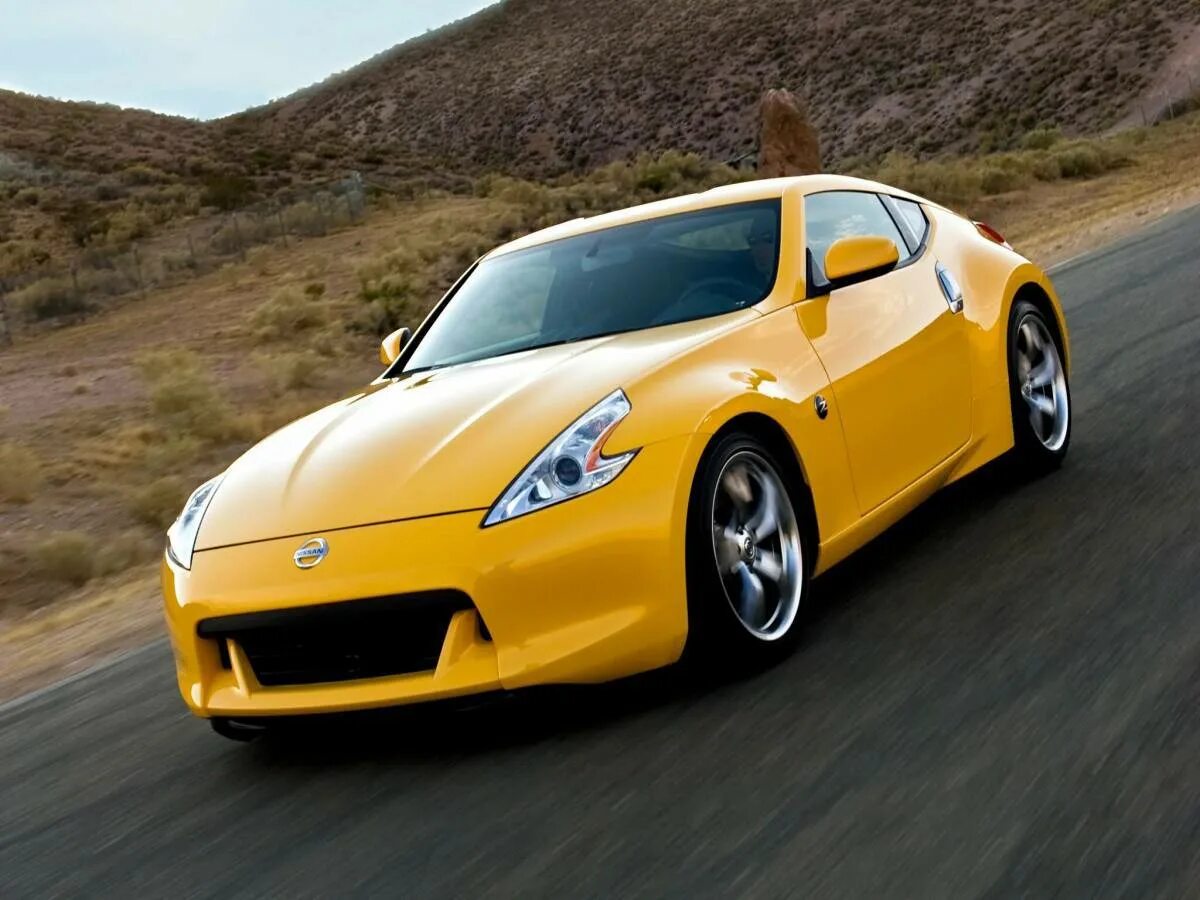 Сайт про машины. Nissan 370z us-spec cars Coupe 2009. Nissan 370z. Ниссан 370z оранжевый. 2010 Nissan 370z.