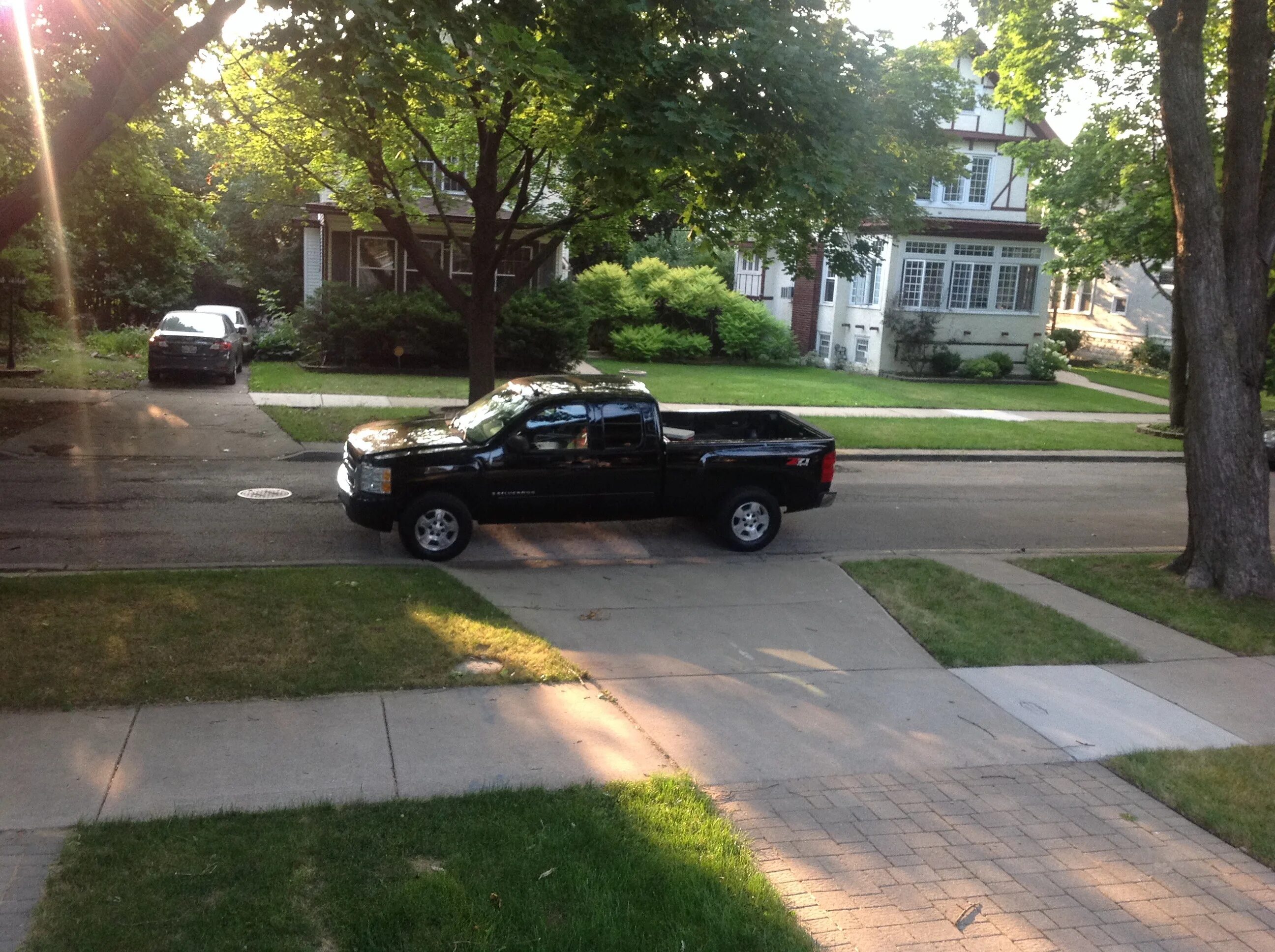 Parking way driveway. Driveway and Street image. Driveway in Front of the Block of Flats. Car on the sidewalk. Own drive