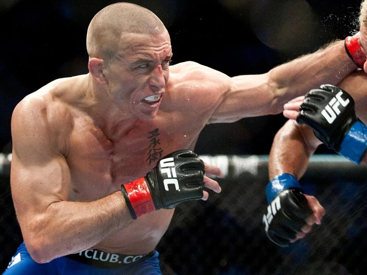 Gsp боец ufc. Сен-пьер боец. Джордж сент пьер с поясом. Джордж сент пьер с поясом. Джордж сент-пьер статистика.