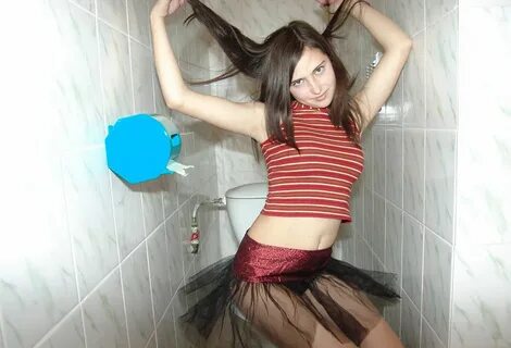 Young brunette shows her pinkhole. 