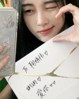 Sakura received a signed album from Ju Jingyi, a Chinese singer and actress...