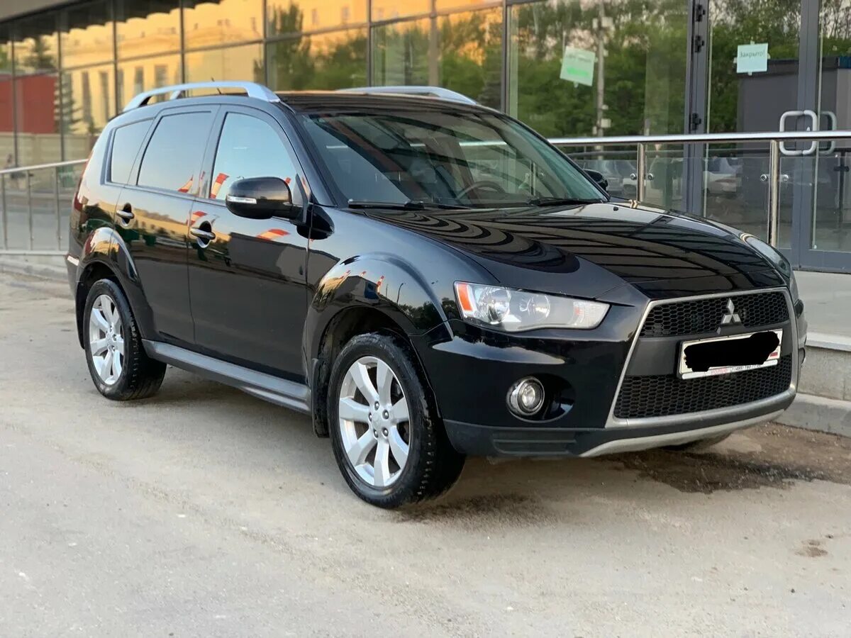 Мицубиси аутлендер хл 2010. Mitsubishi Outlander 2010. Митсубиси Аутлендер 2010 черный. Mitsubishi Outlander XL 2012 черный. Mitsubishi Outlander 2010 черный.