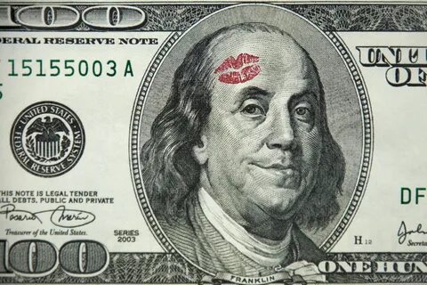 Ben Franklin, on a hundred dollar bill, smiles, having recieved a kiss on t...