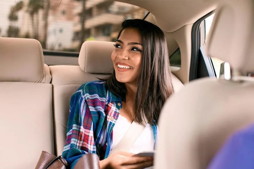 Get off the car. Woman in car. In the back Seat. Lady in the back Seat of a car. Ride in a car.