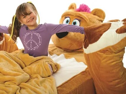 The teddy bear is the bed