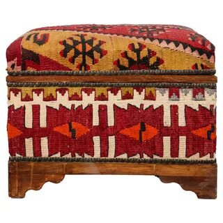 Tribal wood bench upholstered in Kilim rugs, with storage compartment under...