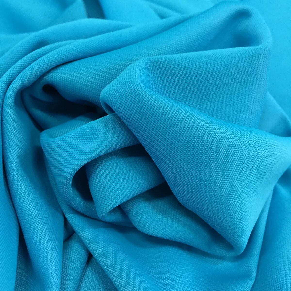 Трикотажный хлопок голубой. Трикотаж синего цвета. Ткань плательная. Трикотажная плательная ткань.