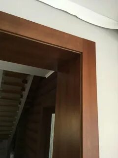 Отделка проема двери доборами и наличниками