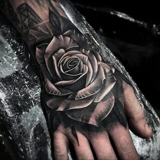 Male rose tattoo on hand