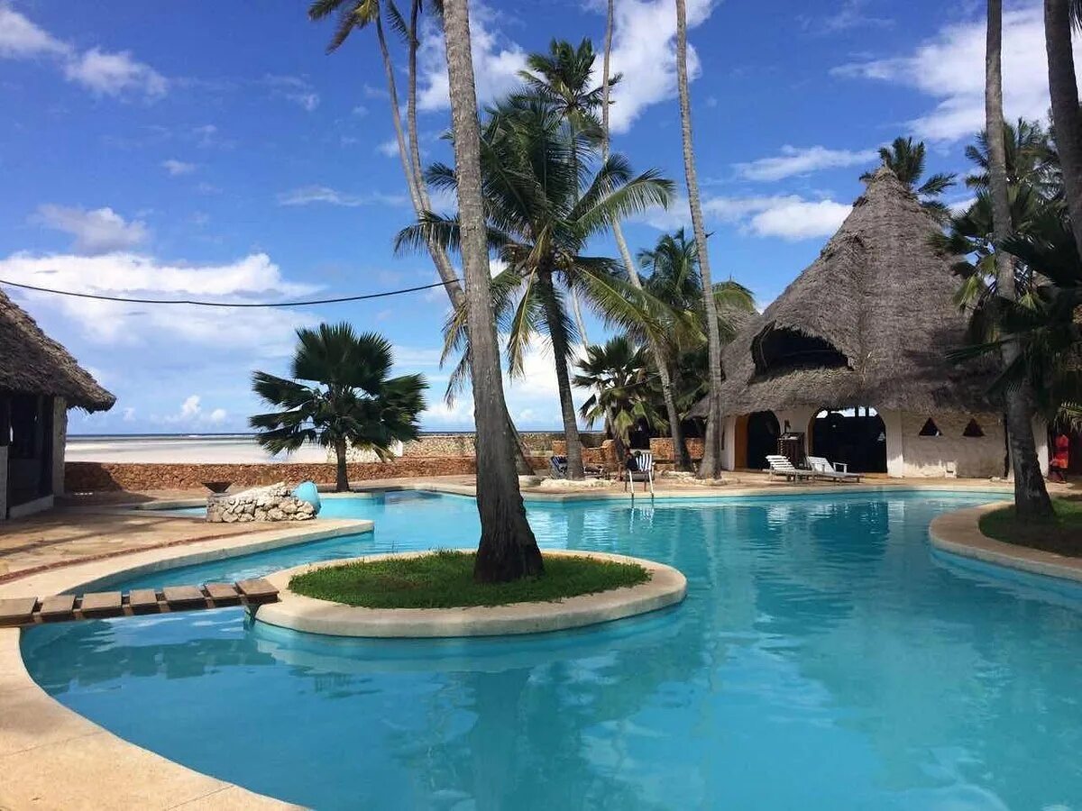 Танзания занзибар. Риф бич. Reef & beach resort 3*. Reef beach resort отзывы. Coral reef 3 занзибар.