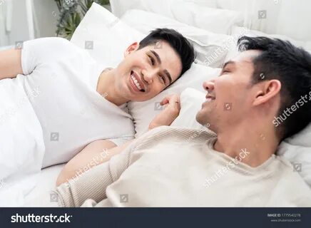 LGBT concept, Asian gay lover, just married homosexual couple lying on bed ...