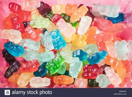 Find more A close up of three rows of brightly colored gummy bears. 