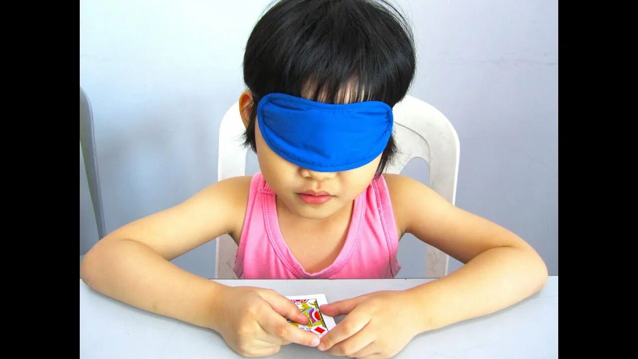 Tied round. Blindfolded collect objects Kids. Pick Toys blindfolded game.