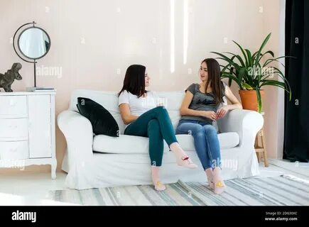 Two girls talking other on hi-res stock photography and images - Alamy