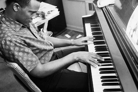 John playing the piano