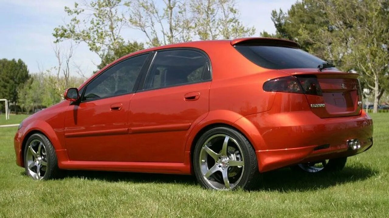 Тюнинг лачетти хэтчбек. Chevrolet lacetti хэтчбек обвес. красный шевроле лачетти хэтчбек на литье. тюнингованная шевроле лачетти хэтчбек. chevrolet lacetti tuning disk хэтчбек.