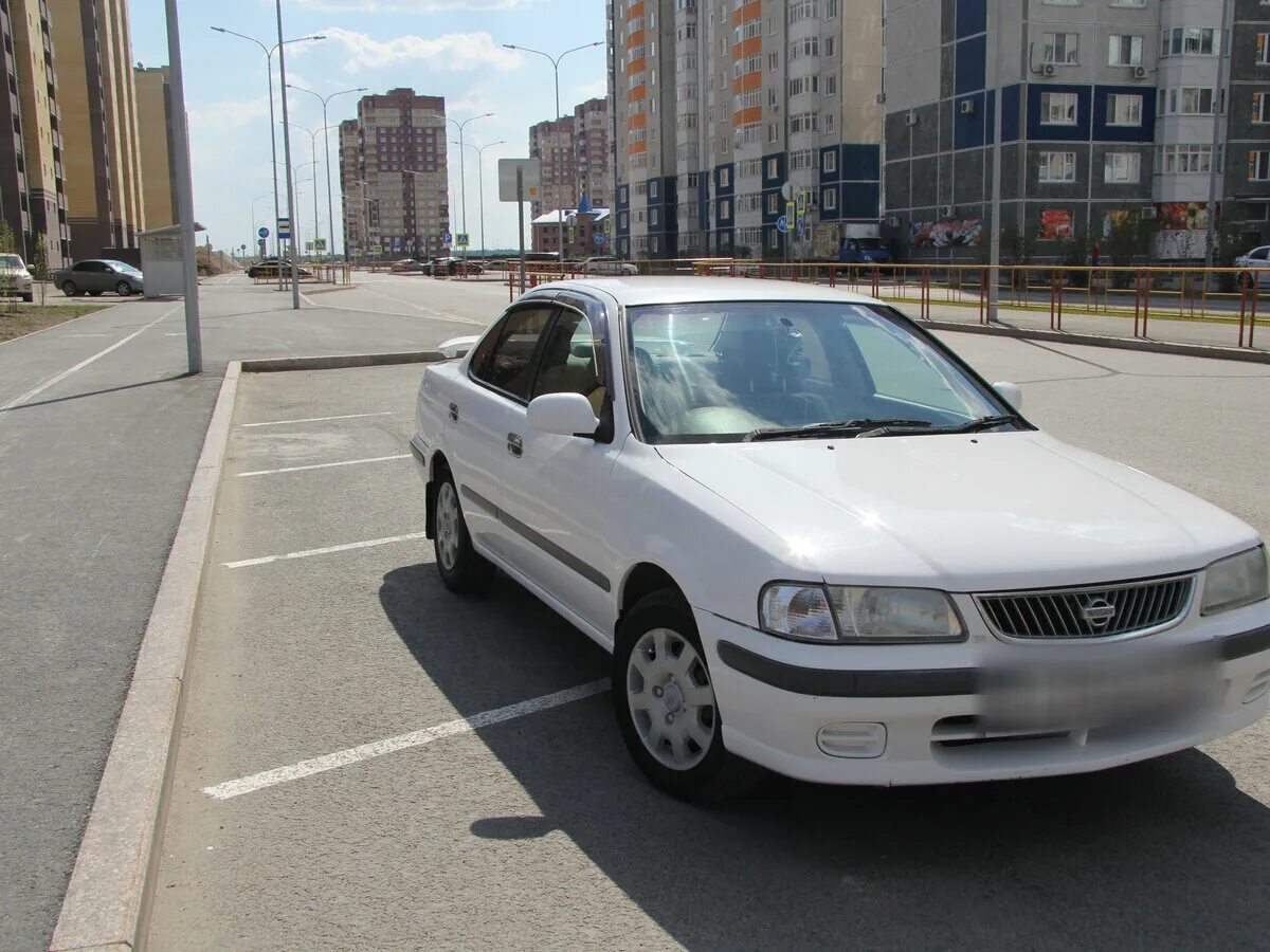 Санни бел. Ниссан Санни b15. Nissan Sunny 2001 белый. Ниссан Санни белый. Ниссан Санни 2001 года белый.