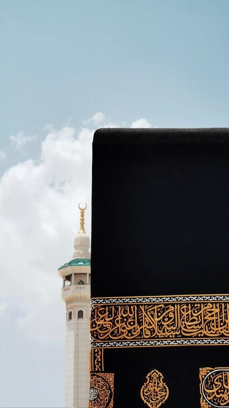 Download A Mosque Lit Up At Night Wallpapers.com