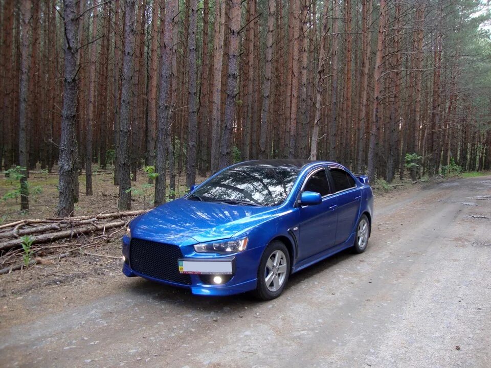 Купить митсубиси в беларуси. Лансер 10 синий. Mitsubishi Lancer 10 синий металлик. Ланцер 10 голубая лазурь. Митсубиси Лансер 10 бирюзовый цвет.