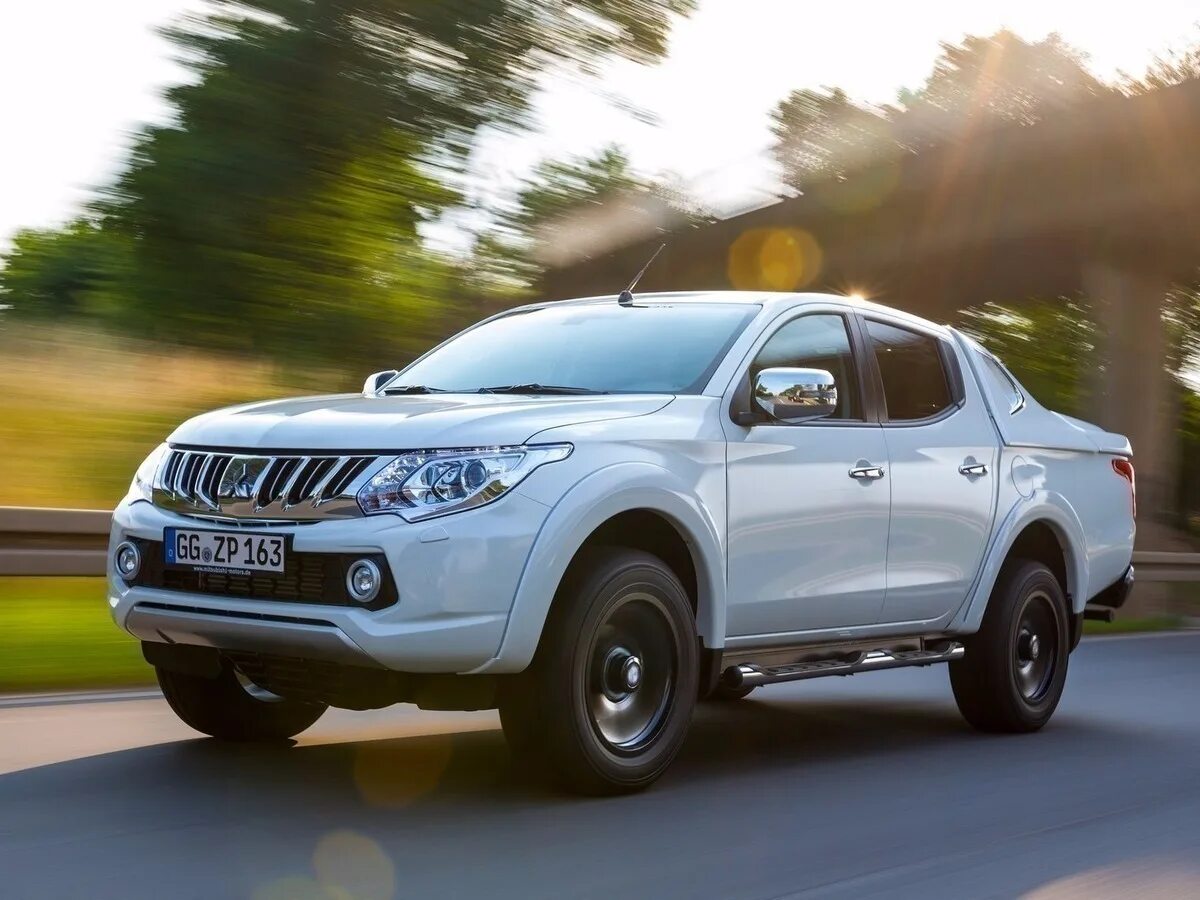Mitsubishi l200 силовой бампер. Мицубиси пикап л200. Грузоподъемность л200. Mitsubishi l200 багажник. Мицубиси л200.