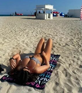 CLAUDIA ROMANI in Bikini at a Beach in Miami 02262023.