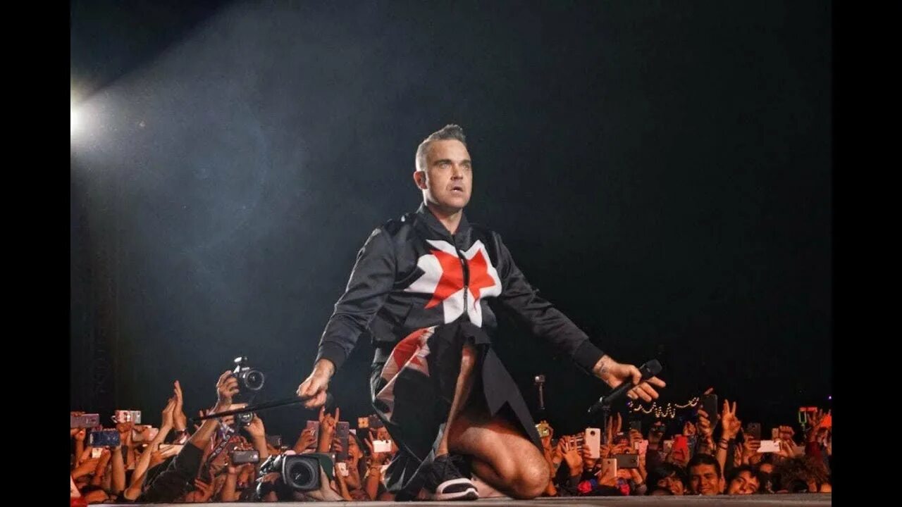 Миллениум песня робби уильямс. Robbie williams the christmas present. Robbie williams millennium. Миллениум клип. Робби уильямс 2022.