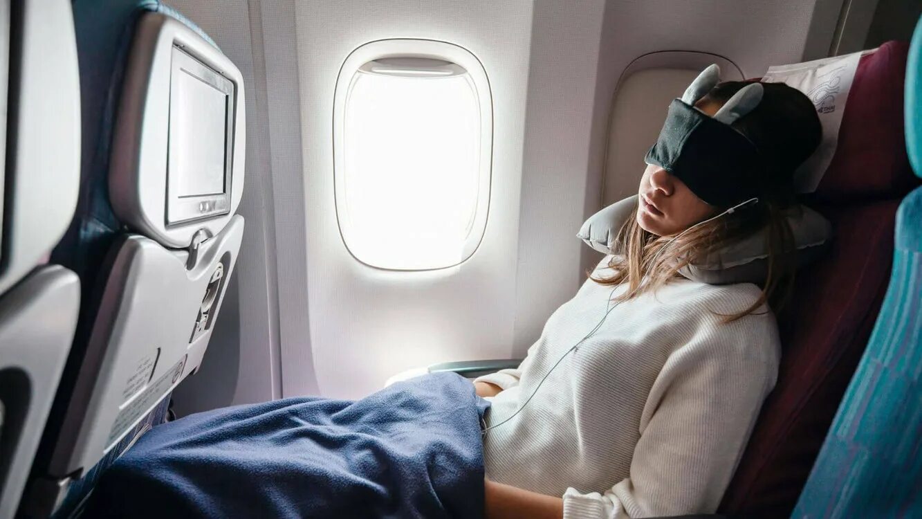 Sleeping on the plane. Women sleeping on Airplane. Recline your Seat in a plane. Women sleeping on Airplane Sunshine.