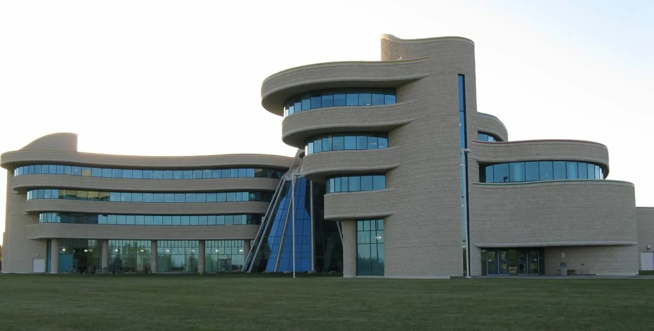 National University of Canada logo.