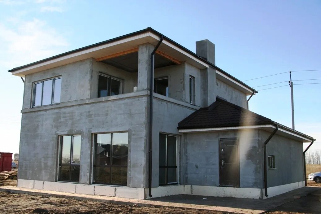 Построить дом из бетона. Дом железобетонный монолит. Монолитный бетонный дом. Монолитный коттедж. Монолитный каркас коттеджа.