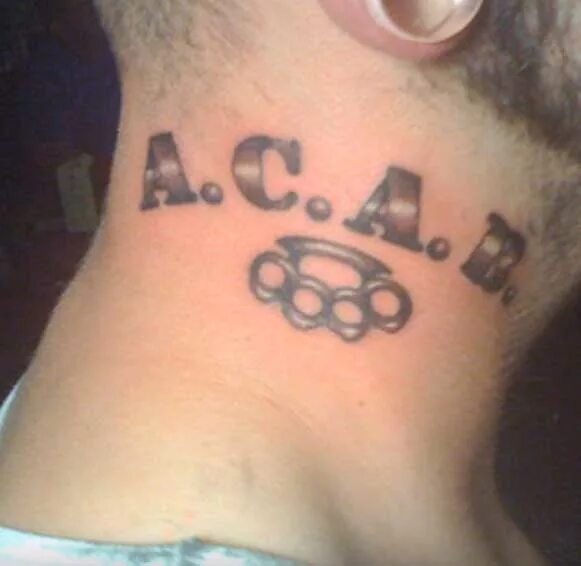 Значение слова a c a b. Тату акаб. Тату акаб на шее. A.C.A.B тату на шее. ACAB кастет.