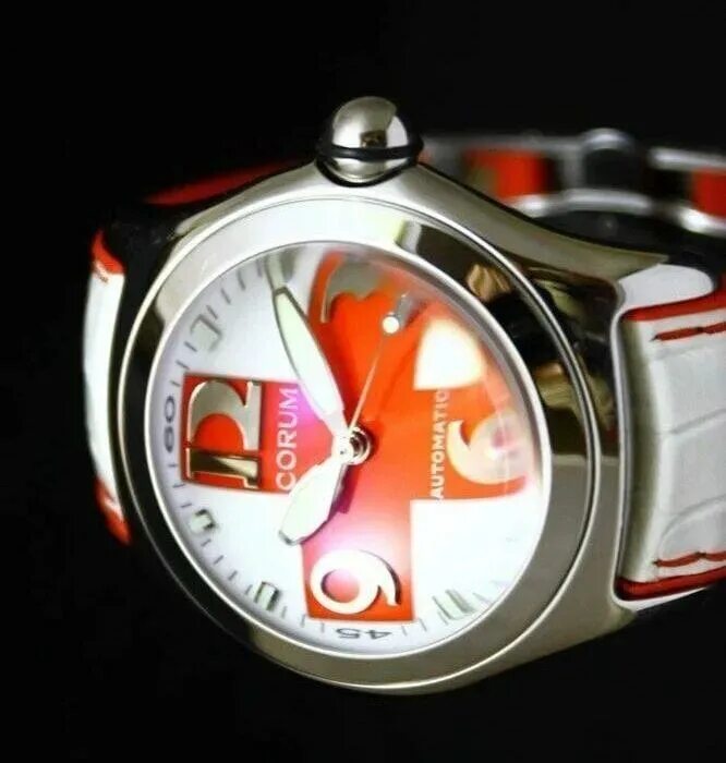 Cross limited. Corum bubble red cross. corum часы limited edition. корум бабл часы. швейцарские часы с красным крестом.