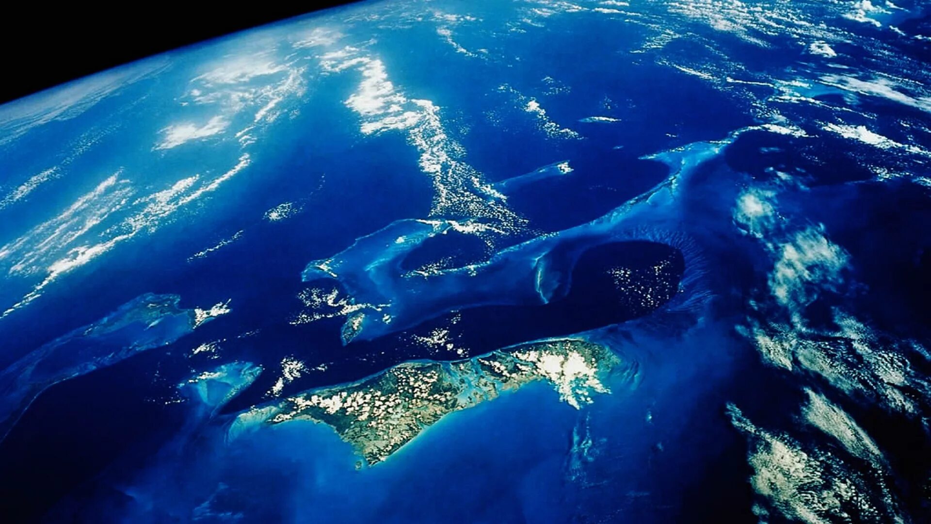 самый молодой по происхождению океан. риф раройя. красивый вид земли из космоса. большой коралловый риф в австралии. тихий океан вид из космоса.