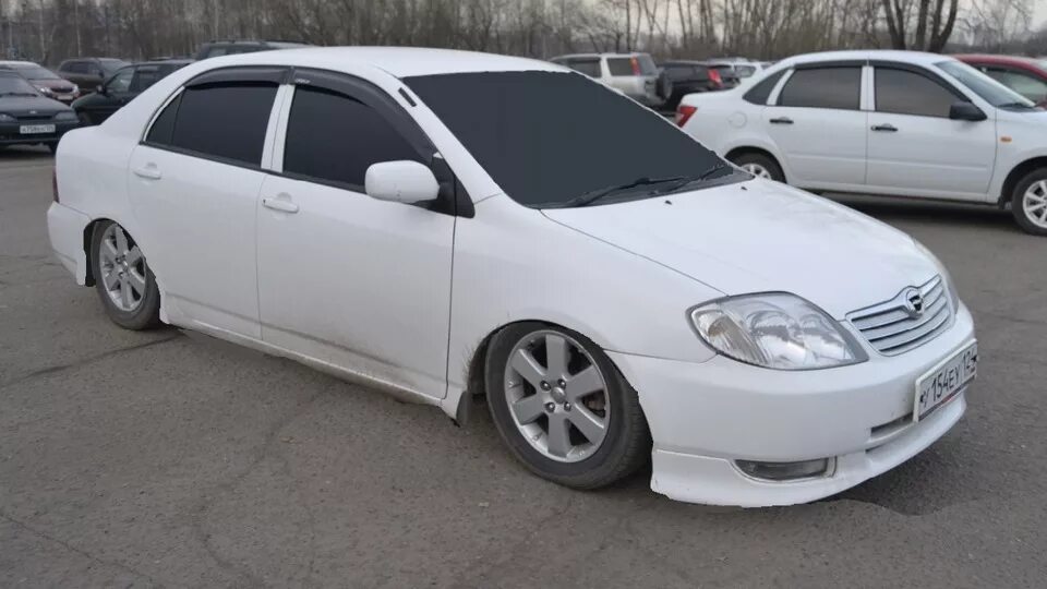 Купить короллу 120 новосибирск. Toyota Corolla 120 белая. Toyota Corolla 120 кузов. Тойота Королла 120 белая. Тойота Королла 120 седан белая.