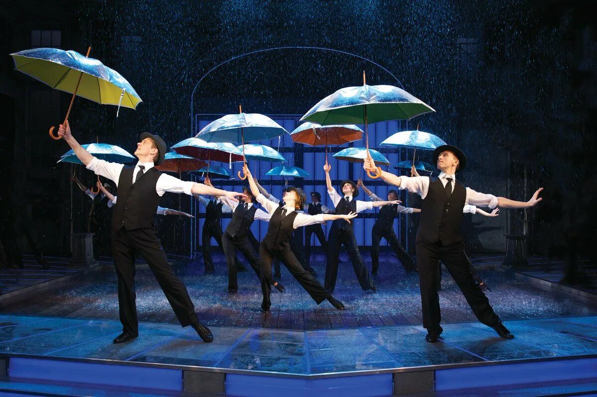 Я пою под дождем. Поющие под дождем мюзикл. Поющие под дождём мюзиуо.