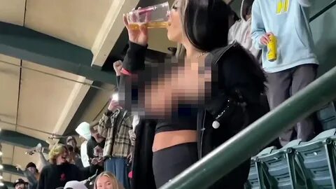 Woman momentarily flashes her breasts at Supercross event and almost sparks a FI