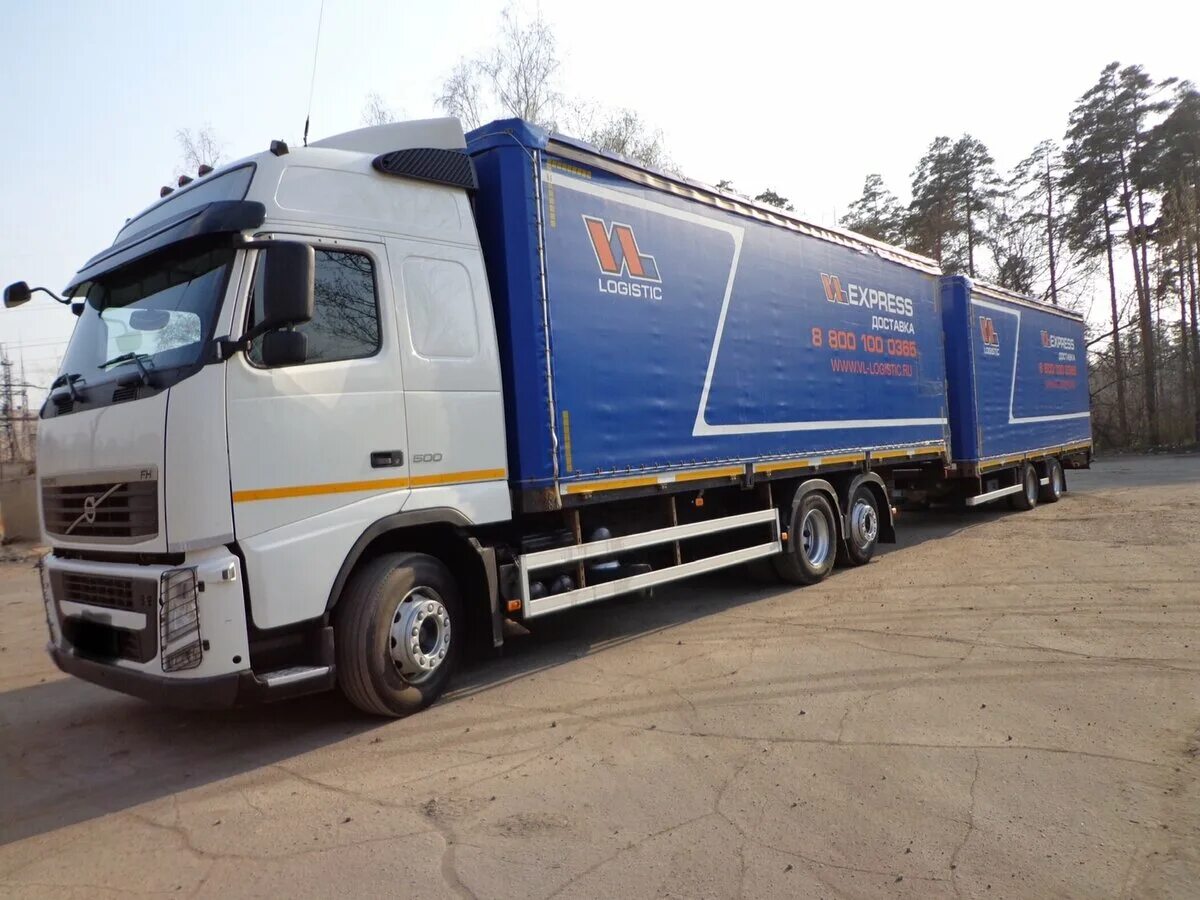 Продажа грузовиков ру. Вольво fh13 бортовая. Volvo FH бортовой. Вольво фм13 с прицепом Тандем. Вольво fh13 с бортовой прицепом.