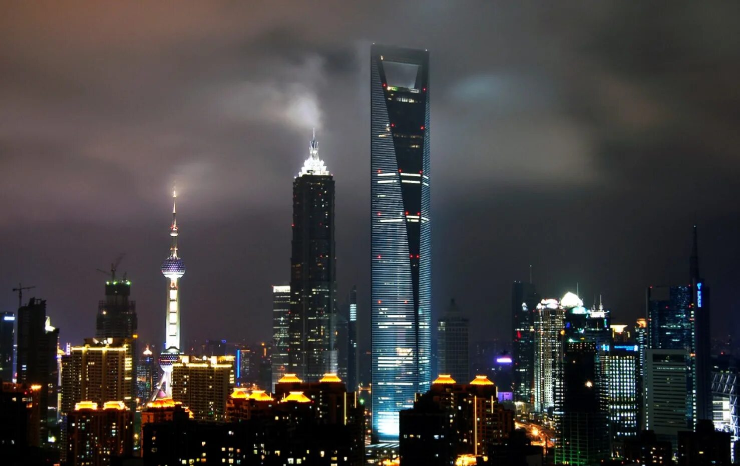 Какой самый высокий город. Шанхайский Всемирный финансовый центр Шанхай. Небоскребы финансовый центр Шанхай. Шанхайский Всемирный финансовый центр (Шанхай, Китай). Шанхайский Всемирный финансовый центр (492 м). Шанхай, Китай.
