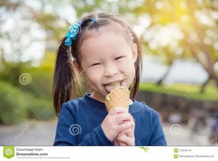 Girl Eating Green Tea Icecream And Smiles In Park Stock Photo - Image.