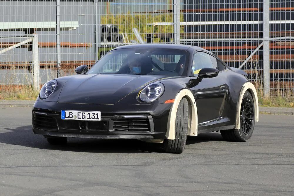 Гос номера на порше 911. Porsche carrera 911 коричневый. 911 какой оператор сотовой связи. 911 чей. Порше 911 с номером 911.