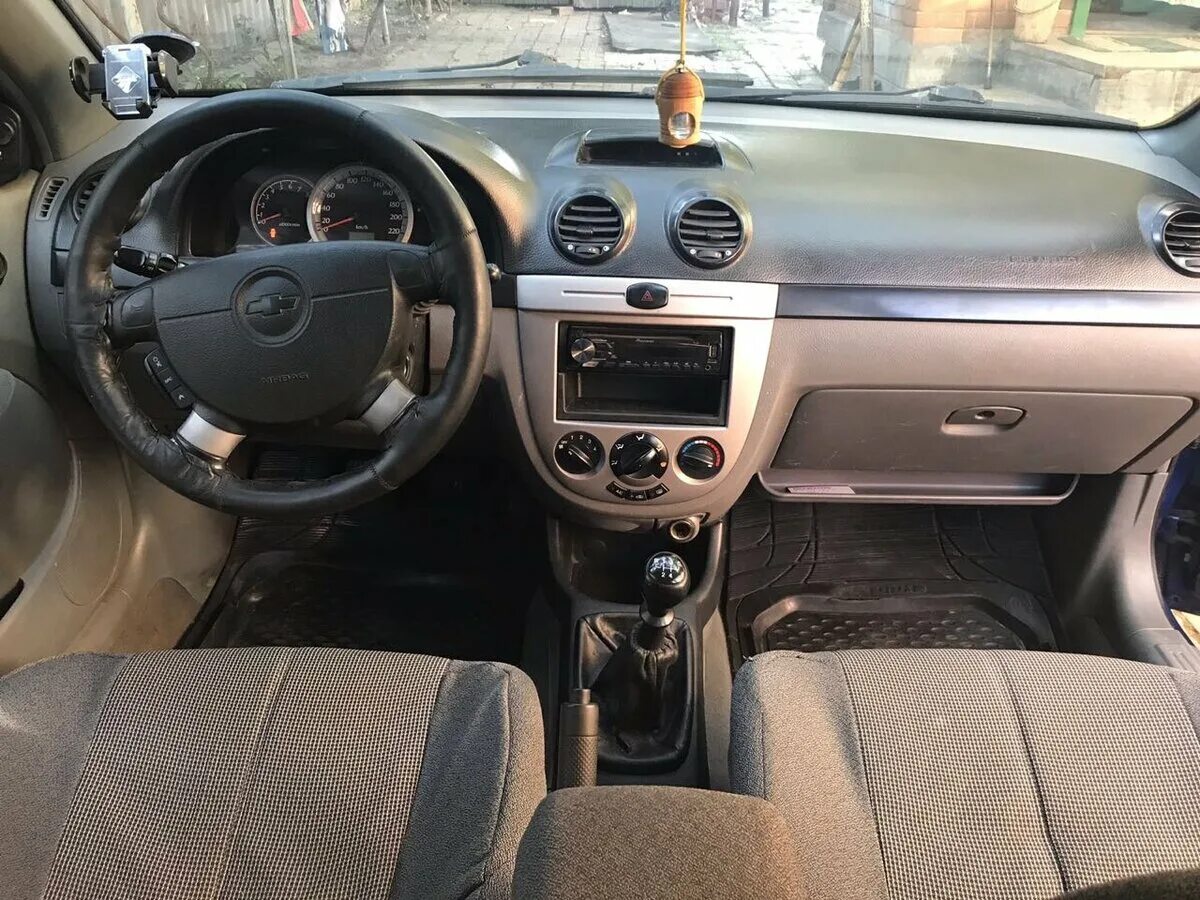 Панель лачетти универсал. Chevrolet Lacetti 2007 салон. Chevrolet Lacetti 2008 салон. Chevrolet Lacetti 2008 хэтчбек 1.6. Шевроле Лачетти хэтчбек 2008 салон.