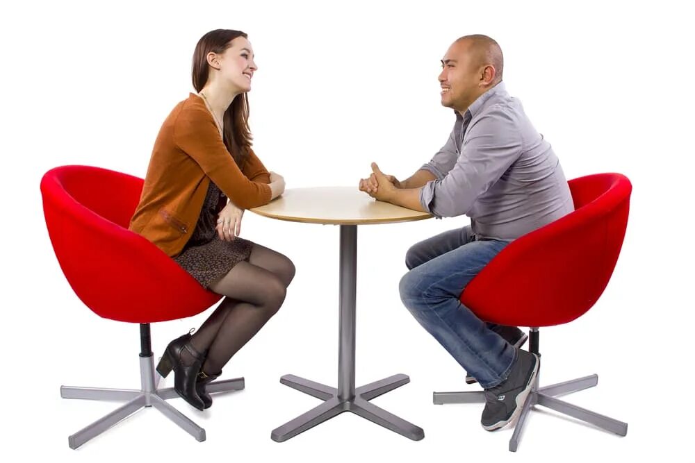 The man sitting next to. Взрослый и молодой беседуют. two people sitting. people sitting at the table. two people sitting at a table.