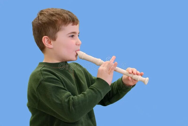 Playing recorder. Kids play recorder. recorder playing group class.