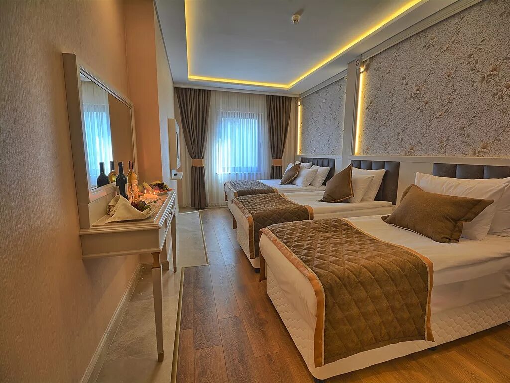 Арнор делюкс отель сиде. Отель Samir Deluxe. Arnor de Luxe Hotel & Spa семейный номер. Milano Hotel Spa 4 Султанахмет Family Room. Арнор Делюкс отель Турция номер комфорт.