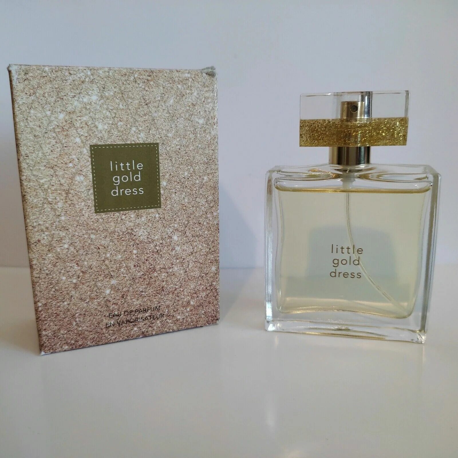 Less gold. Little Gold Dress духи. Золотое платье Парфюм эйвон. Little Gold Dress Avon. Парфюм Пинк дресс.