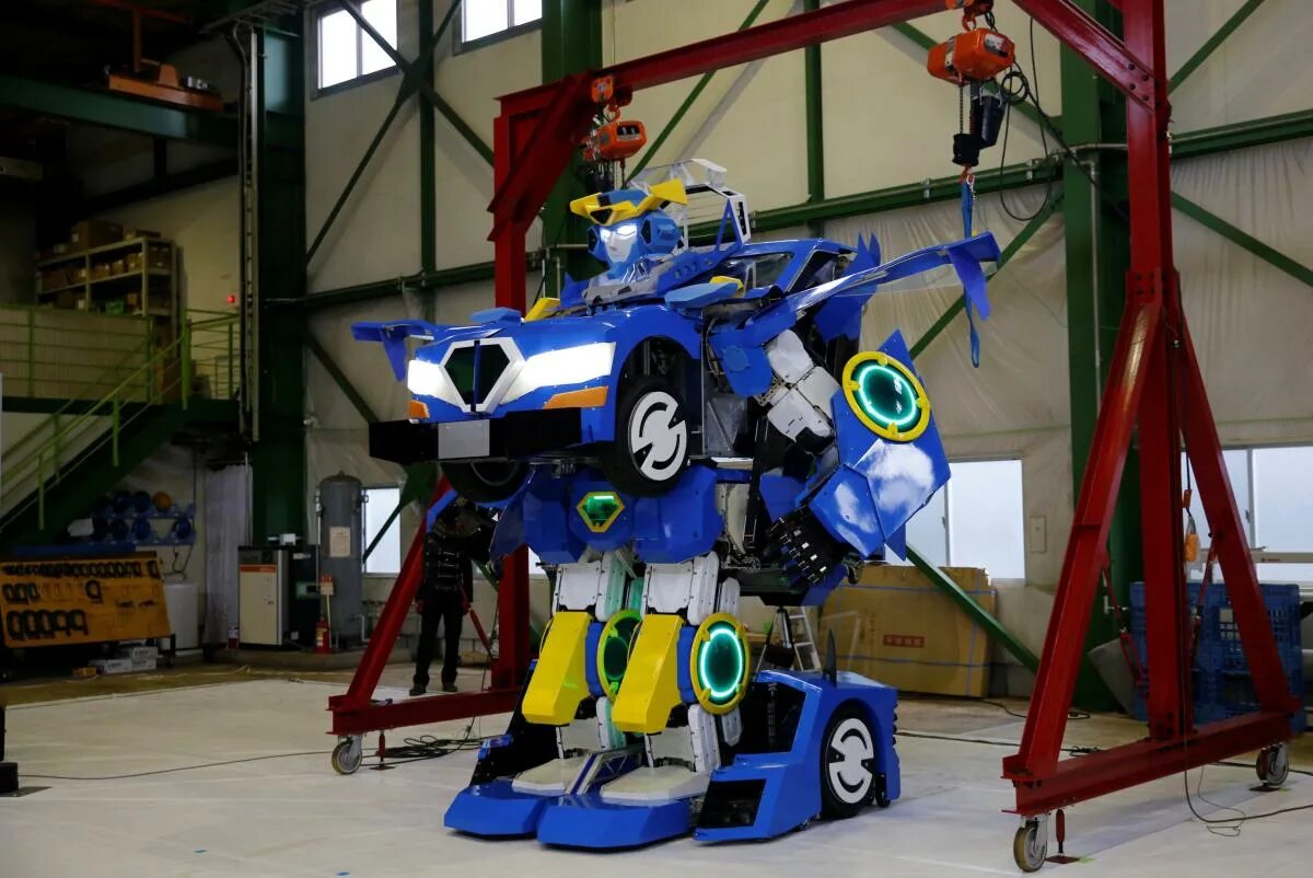 Робот превращается. Трансформер j8017c. Робот-машина. Робот-машина. Робот robosen t9e.