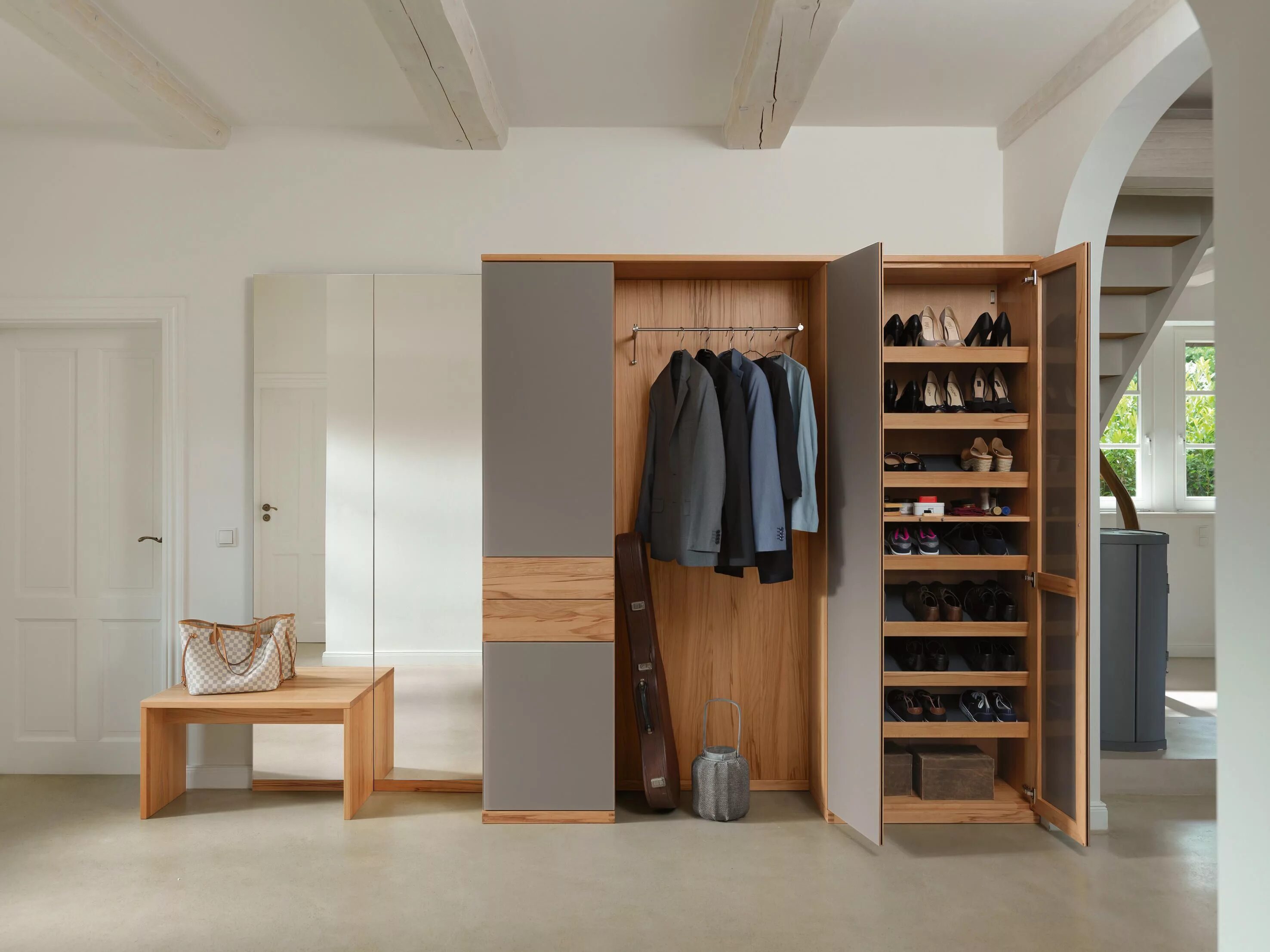 Next to the wardrobe