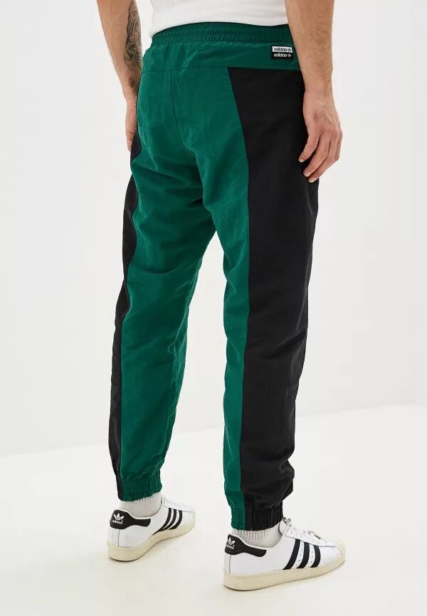 Штаны оригинал купить. Adidas Originals брюки спортивные vocala TP. Штаны adidas Originals Green. Брюки adidas Originals зеленые. Спортивные штаны adidas Originals мужские зеленые.