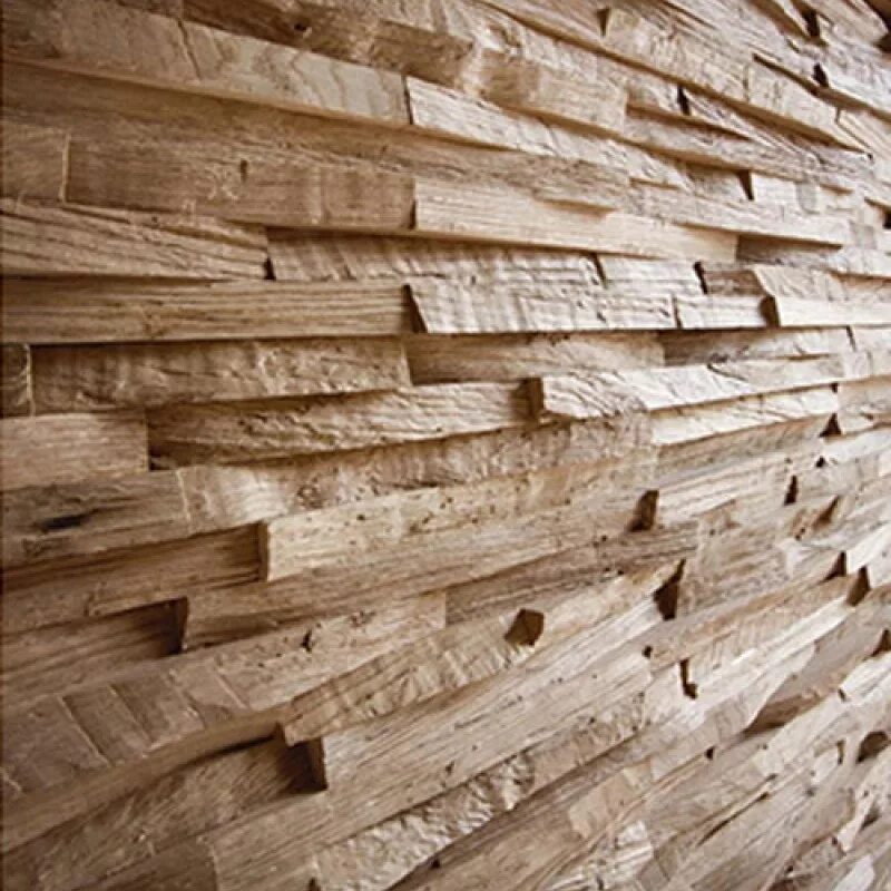 Колотая доска. Стена из дерева. Стеновые панели из дерева. Декоративная стена из досок. Отделка деревянными брусочками.