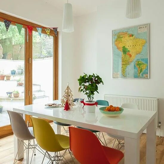 Cottage Dining Room With Industrial-Style Sconces and Chandelier Transitional ki